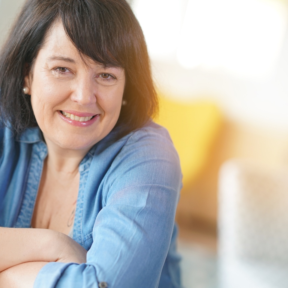 Portrait of smiling 50-year-old woman