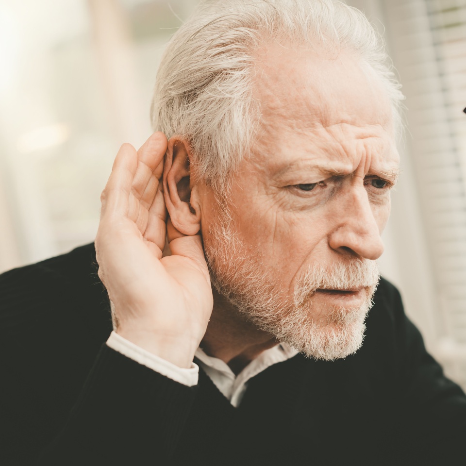 Portrait of senior man having hearing problems