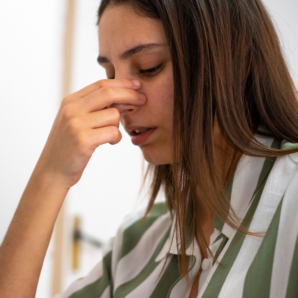 Woman with a nose pain. Sinusitis concept. Broken nose.