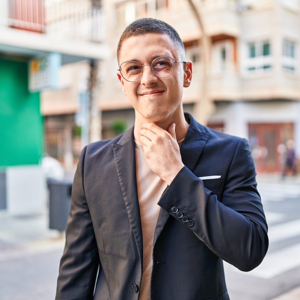 Young hispanic man executive having throat pain at street