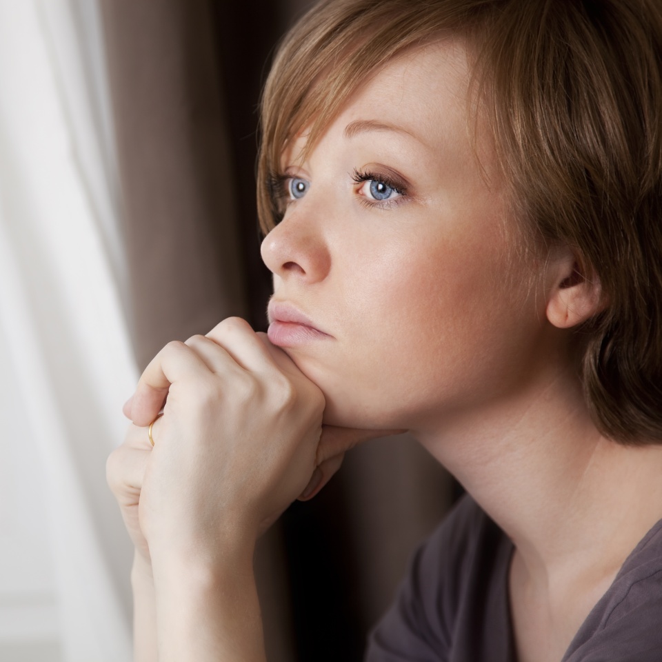 beautiful young woman near the window